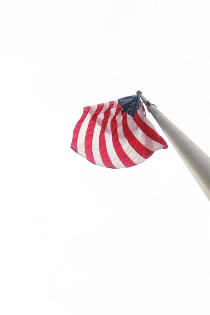 🇺🇸 The Complete Guide to Studying, Working, and Living in the United States (2026 Edition) an american flag blowing in the wind
