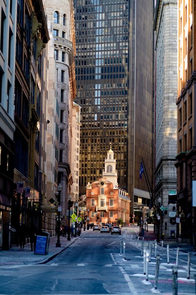 AI Jobs in the USA That Pay the Most in 2026 a city street with tall buildings and a clock tower