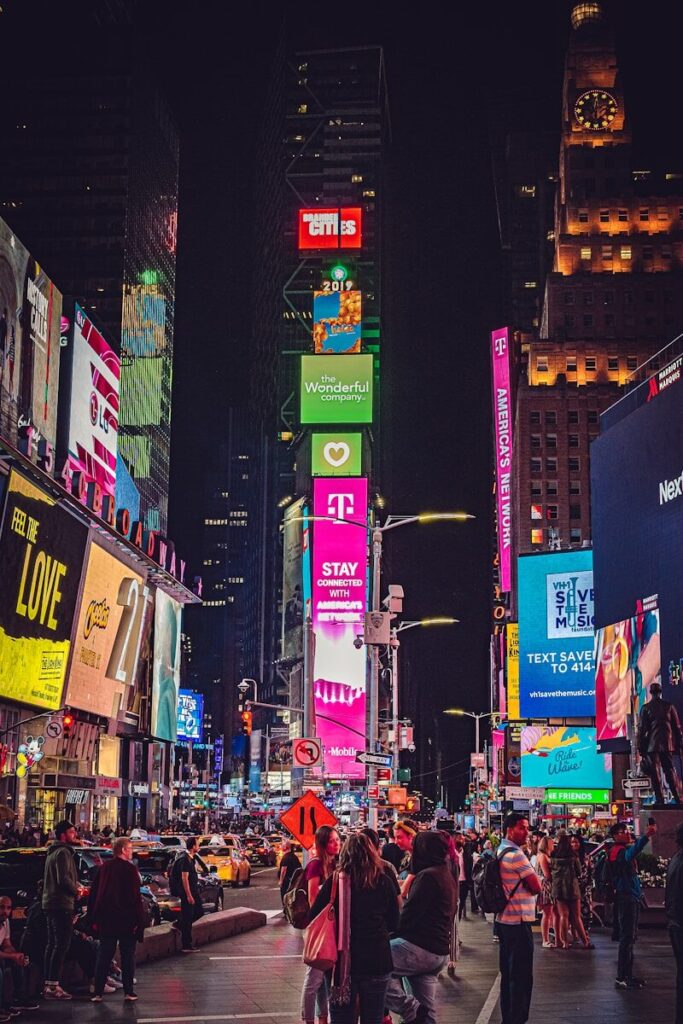 My First Day in America: That Feeling They Don’t Tell You About 🇺🇸💫 people walking on street during nighttime