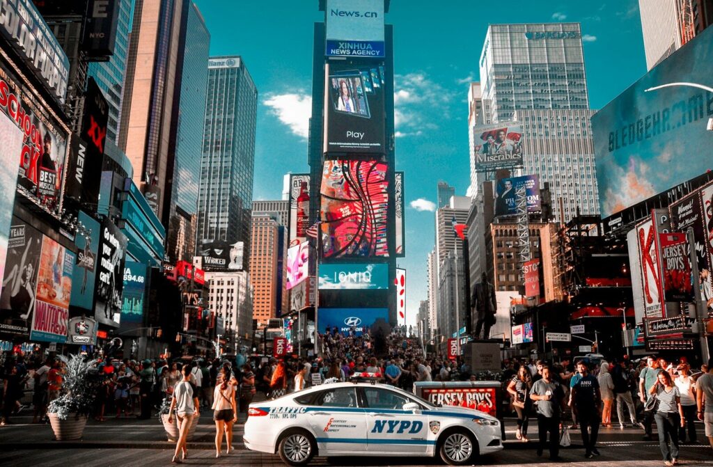 🇺🇸 IELTS & TOEFL Requirements for Studying in the United States: A Complete Guide for 2026 people walking on pedestrian lane during daytime